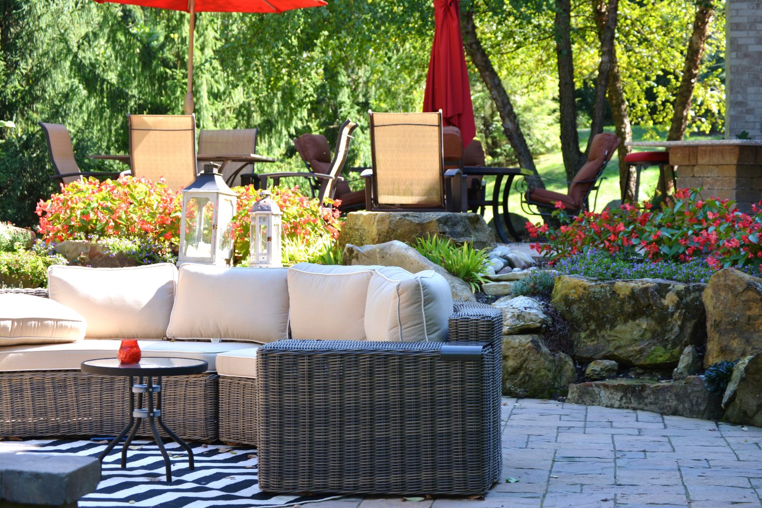 Pavers and patio furniture surrounded by professional hardscaping in a Muncie Indiana yard by Plant Studio Landscape