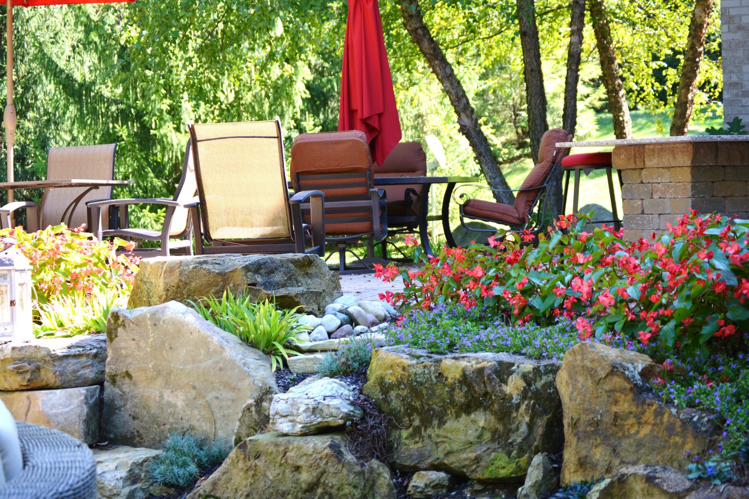 Hardscaping inspired by nature including integrated retaining work by Plant Studio Landscape in East Central Indiana