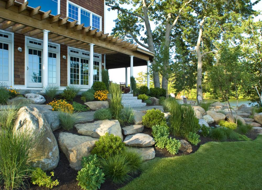 Outdoor living space with kitchen by Plant Studio Landscape in Muncie