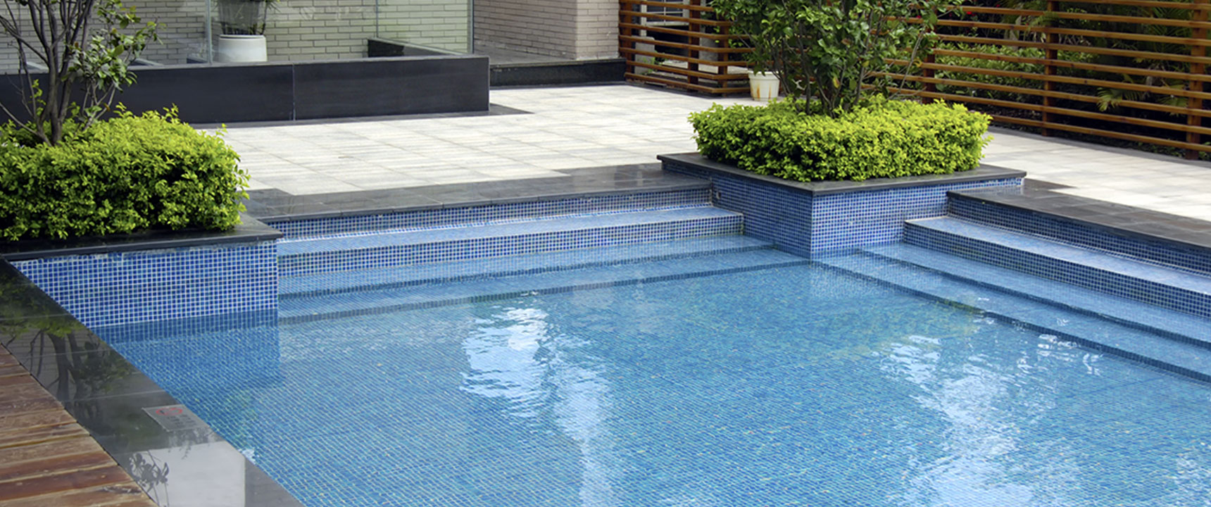 Inground pool integrated into a Muncie back yard by Plant Studio Landscape